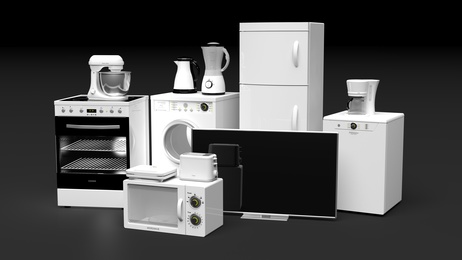 Group of home appliances isolated on black background